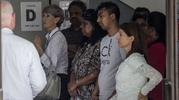 Myuran Sukumaran's mother Raji Sukumaran, centre, and his brother Chinthu Sukumaran, second from right, at Wijaya Pura port to visit her son at Nusakambangan prison on Monday. 