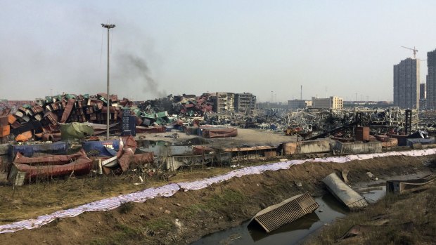 Damaged containers in a waterway near the site of the Tianjin blast.