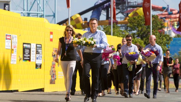 Dreamworld CEO Craig Davidson and his employers laid flowers at the theme park on Wednesday.