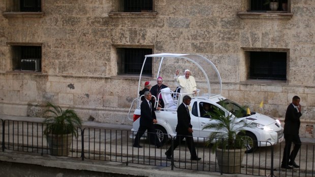 Pope Francis waves from his Popemobile in Havana on Sunday. 