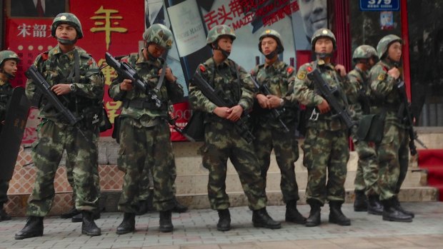 Armed police patrol the streets in Urumqi, Xinjiang, last year. 