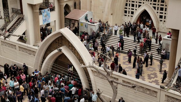 People gather outside the St George's Church after the attack in Tanta, Egypt, on Sunday.
