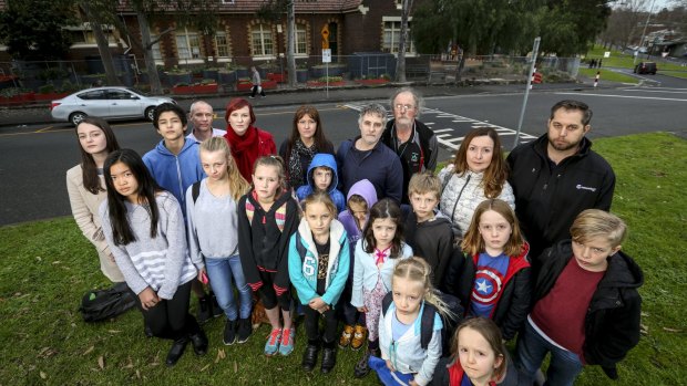 North Melbourne Primary School parents and students are calling for an end to overcrowded classrooms. 