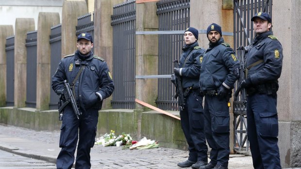 Danish police officers secure the area outside of a synagogue on Sunday. 