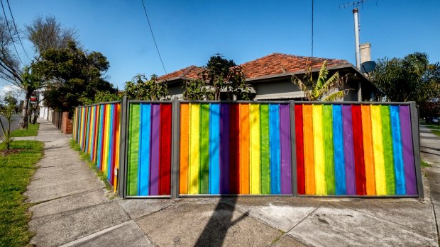 A rainbow-hued fence surrounds a house in Francis Street, Yarraville.