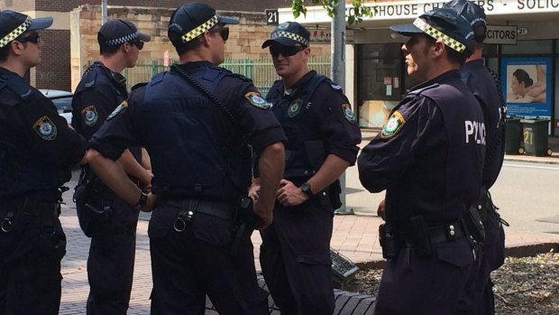Two charged: police outside Parramatta Local Court.