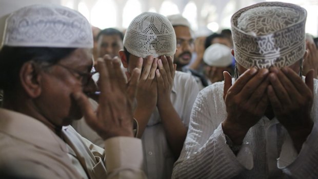 The father, left, and son, centre, of secular publisher Faisal Arefin Deepan at his funeral last year. Deepan was hacked to death and three other people wounded in attacks in Dhaka claimed by Muslim radicals.