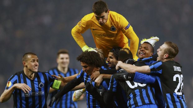 Belgian foray: Mat Ryan rejoices with Club Brugge teammates during their Europa League campaign earlier this year.