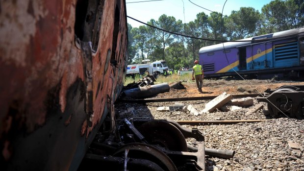 South Africa's transport minister says at least 12 people died and more than 260 were injured in a collision between a truck and a passenger train. 
