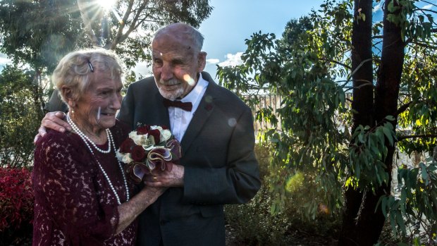 Holding hands and plenty of kissing will be the secrets to a happy marriage, newlyweds Sylvia Martin and Frank Raymond said.