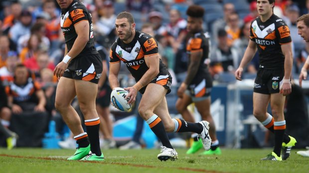 The unhappy hooker: Robbie Farah runs the ball during the round 25 NRL match between the Wests Tigers and the New Zealand Warriors at Campbelltown Sports Stadium. Farah is fuming after being told to look elsewhere in 2016.