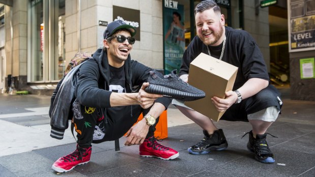 Jordan David and Dustin Crawley with their new sneakers and prized sneaker box.