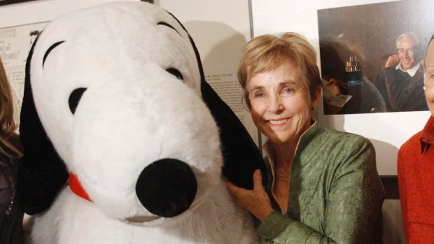 Charles Schulz' widow, Jean Schulz, with Snoopy during the installation of a portrait of Schulz at the National Portrait Gallery, in Washington in 2010.