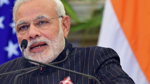 Indian Prime Minister Narendra Modi wearing the suit bearing his own name. 