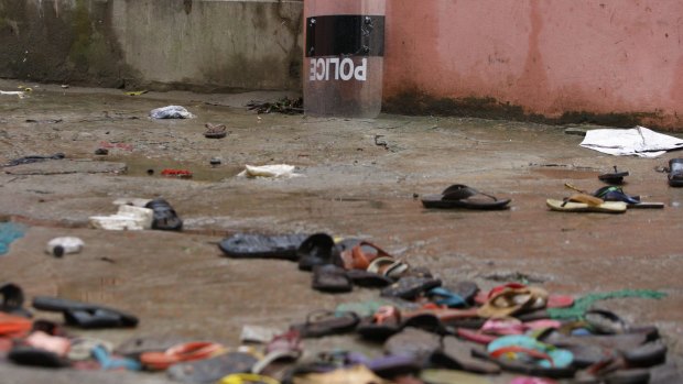 Slippers lie strewn around at the site of a stampede in the town of Mymensingh, 115 kilometres north of Dhaka, Bangladesh, where dozens died on Friday. 