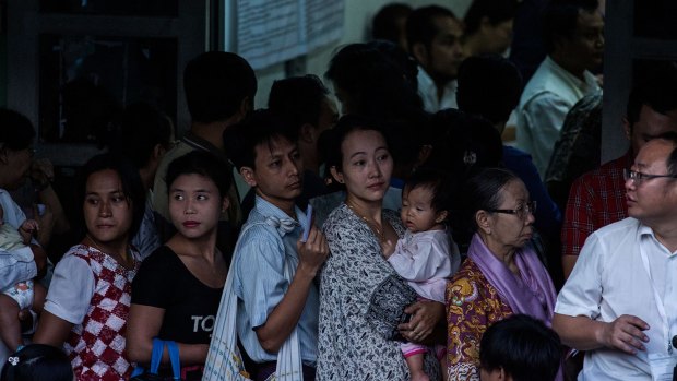 Voters line up at a polling station in the Golden Valley township in Yangon on November 8.