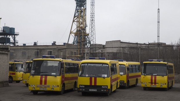 Emergency vehicles are parked outside Zasyadko coalmine in Donetsk on Wednesday.