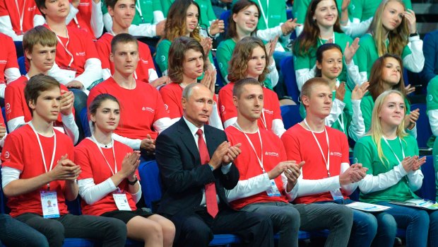 Russian President Vladimir Putin, centre, applauds during a meeting with students in Yaroslavl, Russia, on Friday where he discussed artificial intelligence.