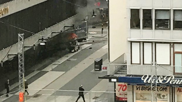 The scene shortly after a truck crashed into a department store in central Stockholm on Friday.