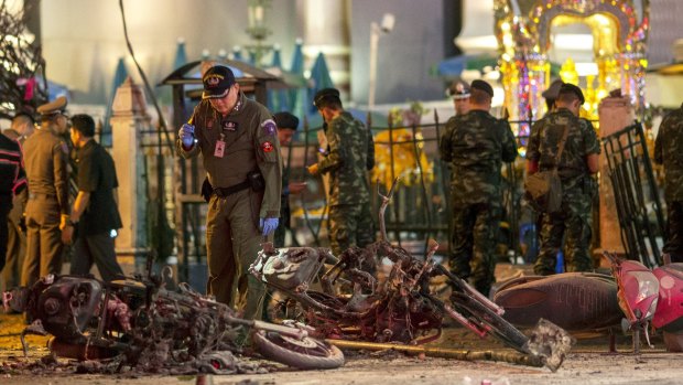 Experts investigate at the site of a blast in central Bangkok.