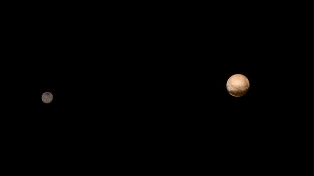 Pluto and its moon Charon pictured from about 6 million kilometres distance.