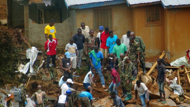 Volunteers search for bodies from the scene of heavy flooding and mudslides in Regent, just outside of Sierra Leone's capital Freetown last week.