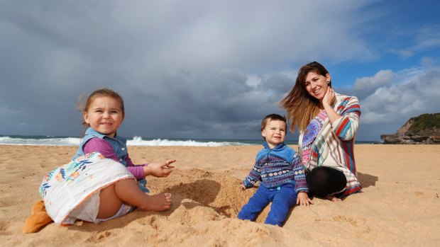 Marian Russell with her two children, Allegra, 2, and Bodie, 1, at Warriewood beach.