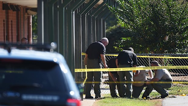 Members of law enforcement investigate an area at Townville Elementary School on Wednesday