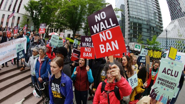 Protesters demonstrate against the travel ban in May.