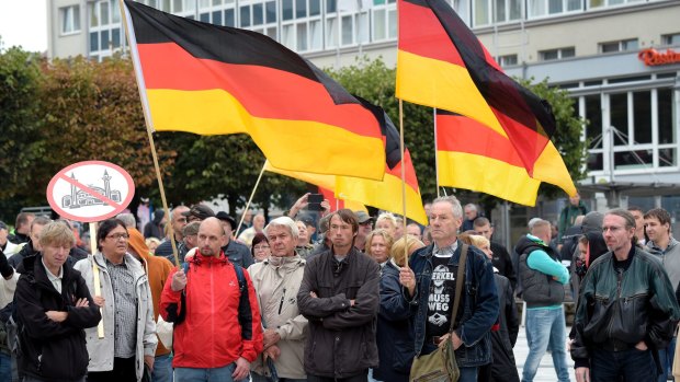 People take part in a demonstration in the east German city of Bautzen on Sunday.