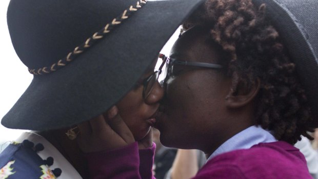 Tori Sisson and Shante Wolfe, kiss after saying their marriage vows in Montgomery, Alabama.