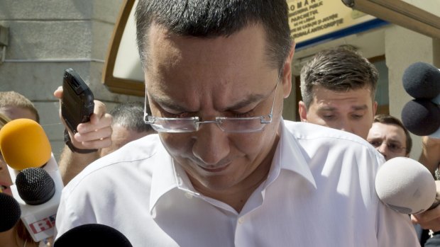 Romanian Premier Victor Ponta surrounded by media as he leaves the national anti-corruption prosecutors office in Bucharest in July. 