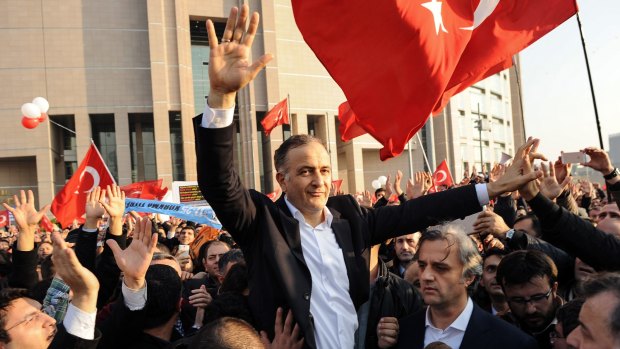 Defiant: Ekrem Dumanli, editor-in-chief of <i>Zaman</i>, outside court after his release.