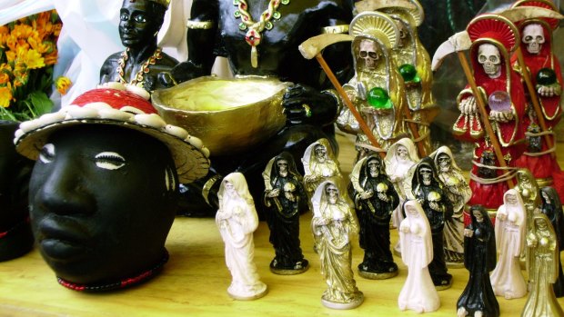 Images associated with the cult of Santa Muerte, the Death Saint, in Mexico.