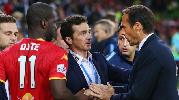 City coach John van 't Schip (right) congratulates his Adelaide United counterpart Guillermo Amor after the game.