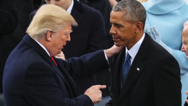 America First: Donald Trump speaks to Barack Obama after his inaugural speech, in which he condemned his predecessors.