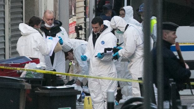 Forensics officers outside 8 Rue du Corbillon in Saint-Denis, Paris, on Wednesday. The bodies of Abdelhamid Abaaoud and Hasna Aitboulahcen have been identified.