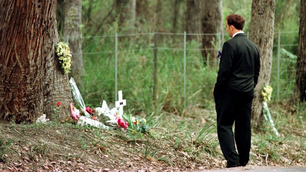 Walter Mikac in front of the tree where his daughter was killed. He was there to attend the one-year memorial service of the Port Arthur massacre.