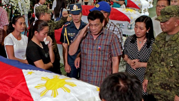 August 2016: Philippine President Rodrigo Duterte salutes the coffins of 15 soldiers killed in a gunbattle with Abu Sayyaf militants in Mindanao.