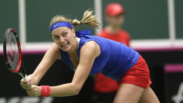Petra Kvitova of the Czech Republic plays a return to Caroline Garcia of France during their Fed Cup match on Sunday.
