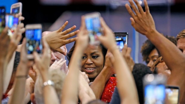 Arizona supporters wave and take photographs after another rousing Michelle Obama speech.