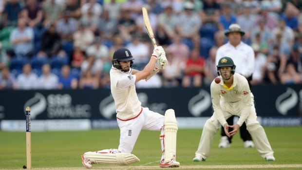 Tail wagging ... Mark Wood lashes the ball to the boundary, helping England reach an overall lead of 411.