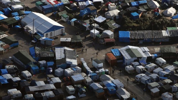 An aerial view of a makeshift migrant camp near Calais, France. The French government is gradually deporting migrants without right to asylum and relocating the rest.