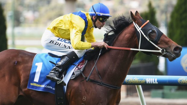 Hat-trick: Dwayne Dunn rides Mawahib to victory on his way to a treble that puts him ahead in the jockeys premiership. 