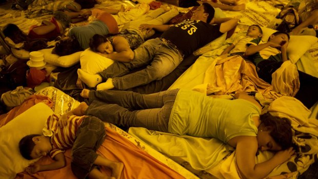 Residents sleep under a makeshift tent outside the emergency centre in Portoviejo, Ecuador.