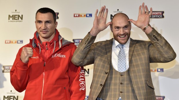 Suited and booted: Tyson Fury, dressed as an English country squire, left German audiences bemused during press conferences in the run-up to the Klitschko fight.