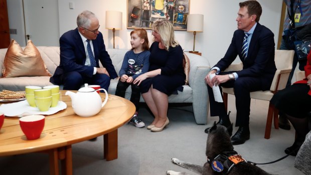 Prime Minister Malcolm Turnbull and Social Services Minister Christian Porter meet with Asha and her mum Katie to discuss the National Disability Insurance Scheme on Thursday.