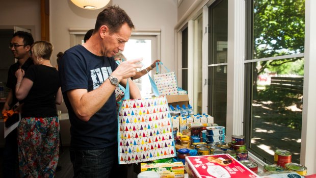 Corrections Minister Shane Rattenbury helped volunteers pack hampers for AMC detainees in the lead up to Christmas. 