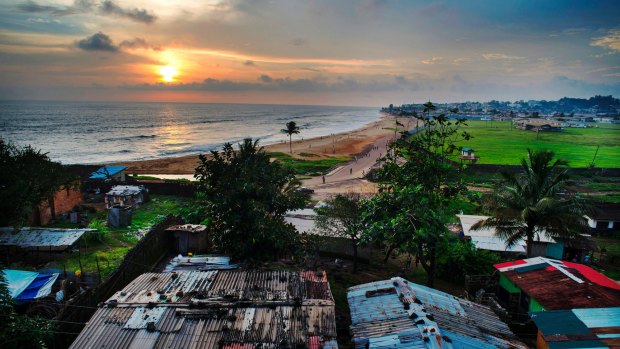 A view of the Atlantic Ocean is seen from the roof of a home in the Capitol Hill area of Monrovia, Liberia