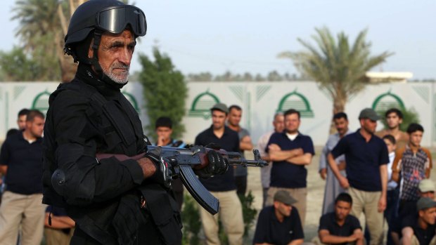 An Iraqi Shiite from Tal Afar in northern Iraq takes part in a parade in Kerbala on October 2.
